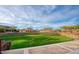 Beautiful community park featuring tiered seating, lush greenery, and scenic views at 22184 N 101St Dr, Peoria, AZ 85383