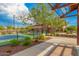 Well-maintained pickleball court surrounded by lush landscaping and walking paths in a vibrant community at 22184 N 101St Dr, Peoria, AZ 85383