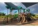Fun-filled community playground with slides, climbing structures, and shaded areas for  at 22184 N 101St Dr, Peoria, AZ 85383