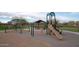 Spacious community playground featuring a variety of play structures and a shaded picnic area at 22184 N 101St Dr, Peoria, AZ 85383