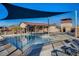 Relaxing community pool area featuring shaded seating and ample space for leisure at 22184 N 101St Dr, Peoria, AZ 85383