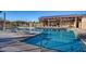 Inviting community pool area with plenty of lounge chairs and covered patio seating at 22184 N 101St Dr, Peoria, AZ 85383