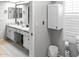 Well-lit bathroom with a granite countertop vanity and ample storage cabinets at 2363 Leisure World --, Mesa, AZ 85206