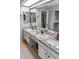 Bathroom vanity with granite countertop, dual sinks, and storage, offering a touch of elegance at 2363 Leisure World --, Mesa, AZ 85206