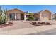 Charming single-story home featuring well-maintained desert landscaping and a two-car garage at 2363 Leisure World --, Mesa, AZ 85206