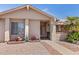 Close up of front exterior featuring decorative flower gardens and a covered front entryway at 2363 Leisure World --, Mesa, AZ 85206