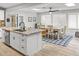 Bright kitchen boasts a large island with granite countertops and stainless steel appliances at 2363 Leisure World --, Mesa, AZ 85206