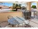 Relaxing covered outdoor patio with a lovely mosaic stone table and comfortable seating at 2363 Leisure World --, Mesa, AZ 85206