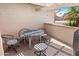 Relaxing covered outdoor patio with a lovely mosaic stone table and comfortable seating at 2363 Leisure World --, Mesa, AZ 85206