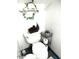 A bathroom featuring a toilet, tile floors, a corner shelf, and a toilet paper holder at 2377 W Hazelwood St, Phoenix, AZ 85015
