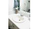 A bathroom sink and mirror with a white counter and decorations at 2377 W Hazelwood St, Phoenix, AZ 85015