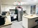 Functional kitchen with white cabinets, stainless steel appliances, and stylish countertops at 2377 W Hazelwood St, Phoenix, AZ 85015