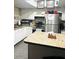 Functional kitchen with white cabinets, stainless steel appliances, and stylish countertops at 2377 W Hazelwood St, Phoenix, AZ 85015