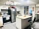 Functional kitchen with white cabinets, stainless steel appliances, and stylish countertops at 2377 W Hazelwood St, Phoenix, AZ 85015