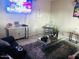 The living room is furnished, has neutral walls, and a tiled floor at 2377 W Hazelwood St, Phoenix, AZ 85015