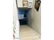 View of the staircase leading to the basement and a door to a room that has a plant at 2377 W Hazelwood St, Phoenix, AZ 85015