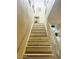 A staircase showing white stairs with wood trim and a white railing at 2377 W Hazelwood St, Phoenix, AZ 85015