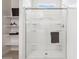 Clean bathroom featuring a glass-enclosed shower with shelving for toiletries at 24105 W Flores Dr, Buckeye, AZ 85326