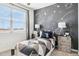 bedroom with space themed wall art, modern lamps, and comfy bedding at 24105 W Flores Dr, Buckeye, AZ 85326