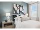 A well-lit bedroom features stylish decor, cozy bedding, and a serene atmosphere, perfect for relaxation at 24105 W Flores Dr, Buckeye, AZ 85326