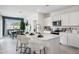Bright and modern kitchen featuring an island with seating and contemporary appliances at 24105 W Flores Dr, Buckeye, AZ 85326