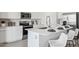 Well-equipped kitchen with stainless steel appliances, a quartz countertop, and a functional layout at 24105 W Flores Dr, Buckeye, AZ 85326