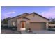 Inviting single story home with a two car garage, manicured landscaping, and a welcoming front entrance at 25357 W Bowker St, Buckeye, AZ 85326