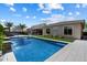 Stunning backyard featuring a sparkling pool, lush landscaping, and a cozy outdoor seating area at 2821 E Cashman Dr, Phoenix, AZ 85050