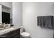 Bathroom featuring granite countertop, modern fixtures, and a decorative towel rack at 2821 E Cashman Dr, Phoenix, AZ 85050