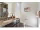Bathroom with granite countertop vanity, modern fixtures, and a glass-enclosed shower at 2821 E Cashman Dr, Phoenix, AZ 85050