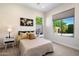 Bright bedroom with a view to the outdoor pool at 2821 E Cashman Dr, Phoenix, AZ 85050