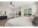 Bright bedroom featuring a pool view and sliding glass door at 2821 E Cashman Dr, Phoenix, AZ 85050