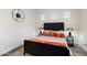 Modern bedroom with a striking headboard, stylish lamps, and vibrant accents at 2821 E Cashman Dr, Phoenix, AZ 85050