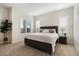 Well-lit bedroom with plantation shutters and neutral decor at 2821 E Cashman Dr, Phoenix, AZ 85050