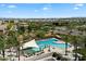 Resort-style community pool with multiple pools, sunshades, palm trees, lounge seating, and desert views at 2821 E Cashman Dr, Phoenix, AZ 85050