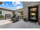 Private courtyard with a modern fountain, outdoor seating, and elegant tile flooring at 2821 E Cashman Dr, Phoenix, AZ 85050