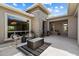 Serene courtyard featuring a modern fire pit, comfortable seating, and elegant stonework at 2821 E Cashman Dr, Phoenix, AZ 85050