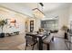 Elegant dining room featuring modern chandelier, seating for six, and large window letting in natural light at 2821 E Cashman Dr, Phoenix, AZ 85050