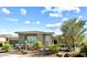 Charming home featuring desert landscaping including cactus and palm trees, enhanced by stone accents at 2821 E Cashman Dr, Phoenix, AZ 85050
