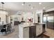 Spacious kitchen featuring a large island, stainless steel appliances, and an open view to the living room at 2821 E Cashman Dr, Phoenix, AZ 85050