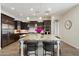 Gourmet kitchen featuring stainless steel appliances, granite countertops, and a large island at 2821 E Cashman Dr, Phoenix, AZ 85050