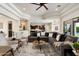 Expansive living room with open layout, neutral decor, tile floors, and seamless flow to kitchen and dining at 2821 E Cashman Dr, Phoenix, AZ 85050