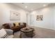 Cozy living room with a comfortable sofa, stylish decor, and ample natural light at 2821 E Cashman Dr, Phoenix, AZ 85050