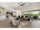 Expansive living room features stylish furnishings, a modern ceiling fan and sliding glass doors to the outside at 2821 E Cashman Dr, Phoenix, AZ 85050