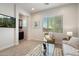 Cozy living room featuring a large window and comfortable seating, perfect for relaxation at 2821 E Cashman Dr, Phoenix, AZ 85050