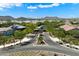 Scenic neighborhood entrance featuring tree-lined streets and beautiful desert landscaping and mountain views at 2821 E Cashman Dr, Phoenix, AZ 85050