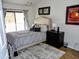 Cozy bedroom featuring a comfortable queen-sized bed and a calming neutral color scheme at 2927 N Oregon St # 7, Chandler, AZ 85225
