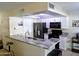 Modern kitchen featuring stainless steel appliances, granite countertops, and white cabinetry at 2927 N Oregon St # 7, Chandler, AZ 85225