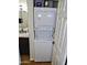 Stackable washer and dryer unit within the bathroom, offering convenience and saving space at 2927 N Oregon St # 7, Chandler, AZ 85225