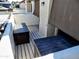 A patio space with dark wood benches and retractable shades, perfect for shaded relaxation at 2927 N Oregon St # 7, Chandler, AZ 85225